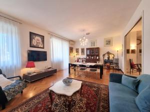 a living room with a couch and a table at Mancini 1 - Gran Madre in Turin
