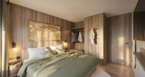 a bedroom with a large bed with lights on the wall at Dirtlergut in Haus im Ennstal