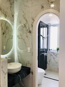 a bathroom with a sink and a toilet and a shower at Happy House in Cam Lâm +97 photos