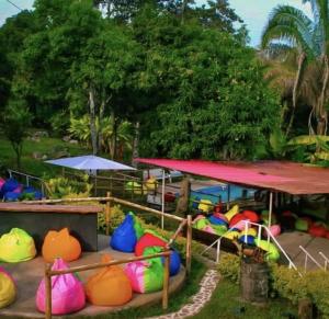 a group of colorful play equipment in a park at La Florida Hotel in El Colegio