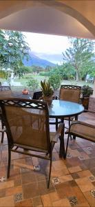 a table and chairs on a patio with a cactus at Finca El Monasterio in Rivas +21 photos