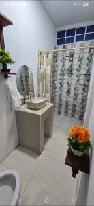 a bathroom with a sink and a toilet and a shower at Finca El Monasterio in Rivas
