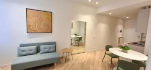 a living room with a couch and a table at Casa Mafalda in Torre Boldone +21 photos