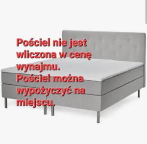 a poster of a bed with the words posted on it at Wallander's hometown, close to beach & café in Ystad