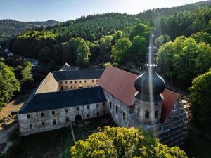 an aerial view of an old building with a black turret at Selská chalupa Anetka in Horšovský Týn