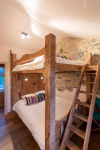 a bunk bed in a room with two bunk beds at B&B - Hotel Le vieux marronnier in Foy-Notre-Dame