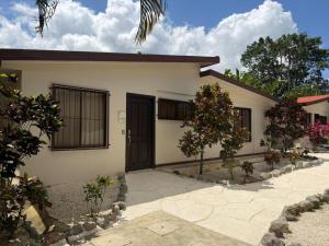 a small house with a driveway in front of it at Orquideas Boutique Hotel in Fortuna