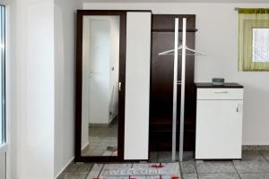 a door in a kitchen with a mirror at Designer Apartement mit Kamin in Hartberg +26 photos