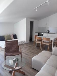 a living room with a couch and a table at Villa Lulu in Orebić