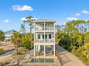 an aerial view of a white house with a balcony at Pet Friendly Beach House with Private Pool - Bella View in Port Saint Joe