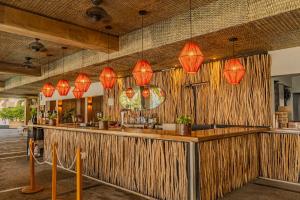 a bar with red lights hanging from the ceiling at Friendly Fun Vallarta Different Experiences - All Inclusive in Puerto Vallarta