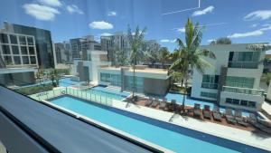 an image of a swimming pool in a building at 710 A Hotel Home Jade in Brasília
