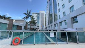 a swimming pool with a red ring in a building at 710 A Hotel Home Jade in Brasília