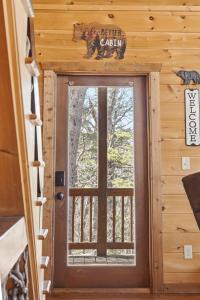 a door to a cabin with a sign that reads better cabin at Majestic Mountaintop Escape in Blue Ridge
