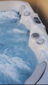 a polar bear swimming in a pool of water at Villa NONO Jure - Private Pool & Jacuzzi, Milna Brač in Milna
