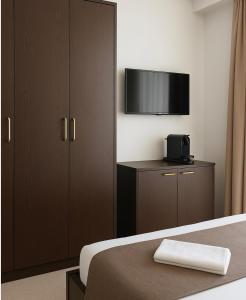a bedroom with a bed and a tv on a cabinet at Villa Ljubica in Pakoštane +22 photos