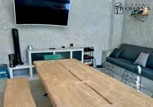 a living room with a table and a couch at Casa Ohana Morelos in Tlayacapan +22 photos
