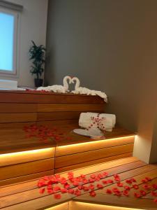 a bedroom with a bed with flowers on the floor at L'Incanto Suite - B&B Surano LE in Surano