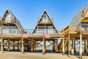 a large wooden house on the beach at Come Enjoy the Best Beach View in Surfside in Surfside Beach