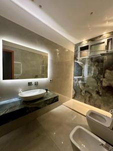 a bathroom with a sink and a mirror at Armonia dell'Etna in Santa Venerina +34 photos
