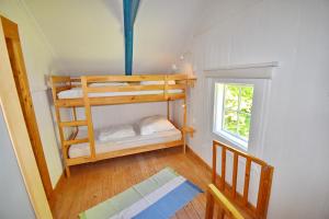 a room with two bunk beds in a house at "Björkhorva" in Vimmerby