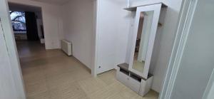 a hallway with a mirror in a white room at Luxury View in Westerburg