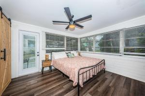 a bedroom with a bed and a ceiling fan at Hidden Gem 3 Bedroom Home in Largo