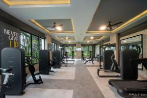 a gym with a row of treadmills and machines at Riu Flamingos - All Inclusive in Nuevo Vallarta