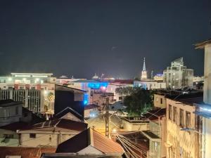 a view of a city at night with buildings at Lagoon Studio Appartement in Fort-de-France