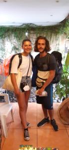 two men are standing next to each other at Hotel Caleta in San Miguel
