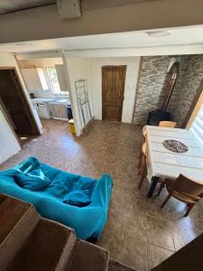 a living room with a couch and a table at Casa Maybell in Chillán +14 photos
