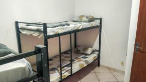 a couple of bunk beds in a room at Hostel Sundays in Angra dos Reis
