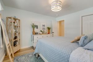 a bedroom with a bed and a dresser and a ladder at Deck, Fire Pit! Fully Updated Home Near Lake Huron in Caseville