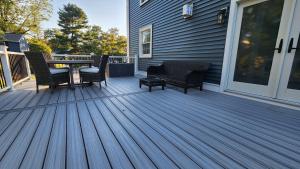 a deck with chairs and a table on a house at Luxury New House 6B4B in Arlington