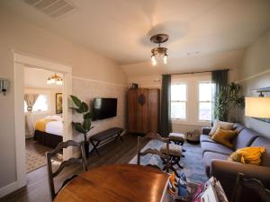 a living room with a couch and a table at RedTail Inn - 3 Suites Sleeps up to 12 in Ashland