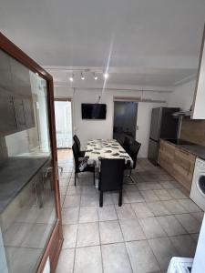 a kitchen and dining room with a table and chairs at Le cabanon in Puyloubier