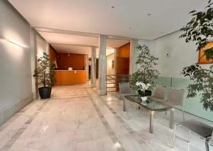 an office lobby with a table and chairs at Victoria Palace T2 de 50m2 in Menton +43 photos
