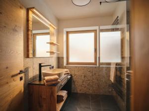 a bathroom with a sink and a mirror at Lodge am Wetterstein in Ehrwald