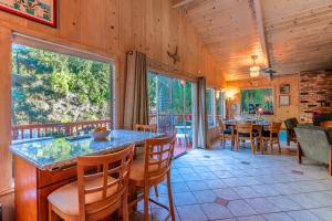 a dining room with a table and chairs at Aunt Ginnys River View in Monte Rio