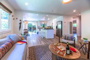 a living room with a couch and a table at Russian River Bungalow in Guerneville