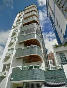 a building with balconies on the side of it at Apartamento 3 quartos próximo à praia central de BC in Balneário Camboriú