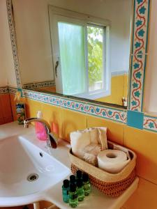 a bathroom with a sink and a toilet and a mirror at Nof Harim נוף הרים in Even Menahem