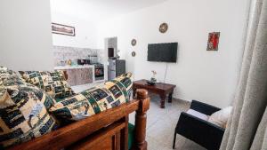 a living room with a couch and a table at Wakesho Apartment A in Malindi