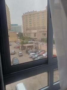 a view of a parking lot from a window at Capital Hotel in Downtown in Cairo