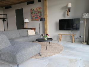 a living room with a couch and a table at Hof van Kleeberg in Mechelen +226 photos
