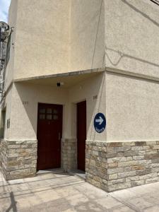 a building with a sign on the side of it at El Buen Descanso in Gualeguaychú +5 photos
