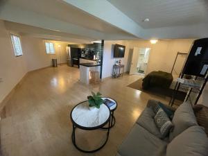 a living room with a couch and a table at Hawaii Private Studio in Holualoa