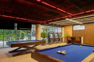 a billiard room with a pool table and several at Fiesta Americana Acapulco Villas in Acapulco