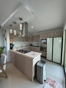 a kitchen with a stove and a counter top at Casa Altavista in Pachuca de Soto