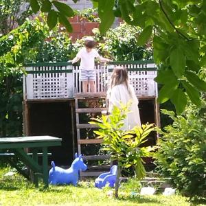 a boy and a girl standing on a bridge at Veliki Banjan in Riznica Kraj